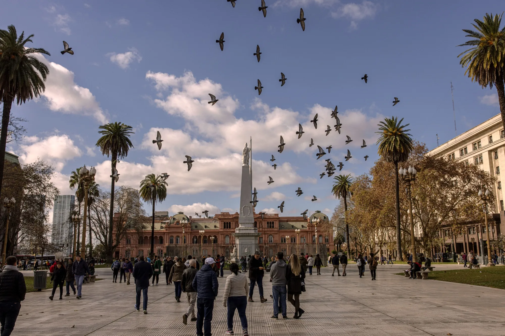 Tourists and pedestrians on Plaza de Mayo in Buenos Aires, Argentina.
