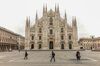 Pedestrians pass the Duomo cathedral in Milan, Italy, on Thursday, March 12, 2020.