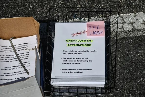 Unemployment forms at a drive-thru collection point in Florida.