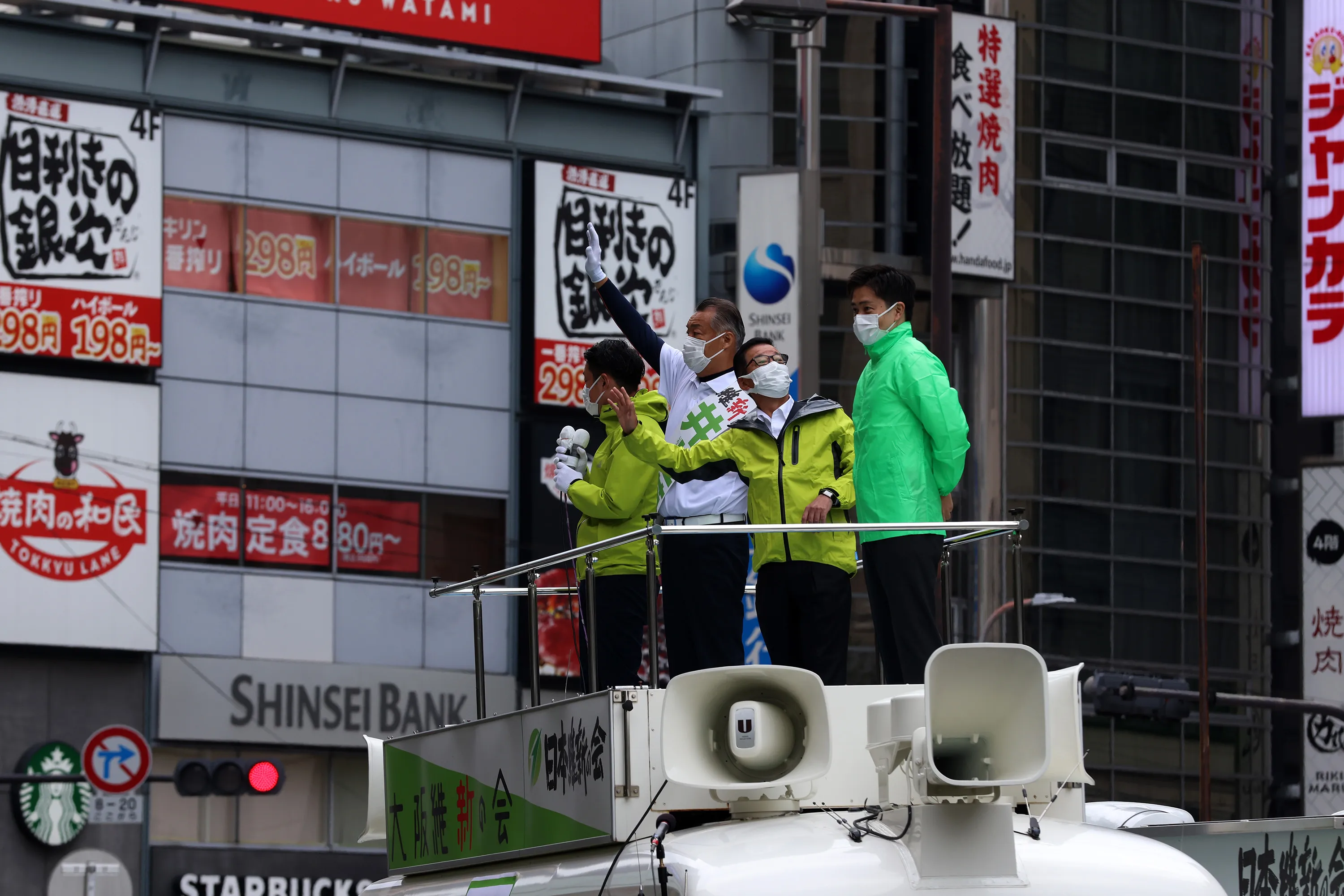 Japan Innovation Party leader Ichiro Matsui, second right, during an election campaign in Osaka on Oct. 19.