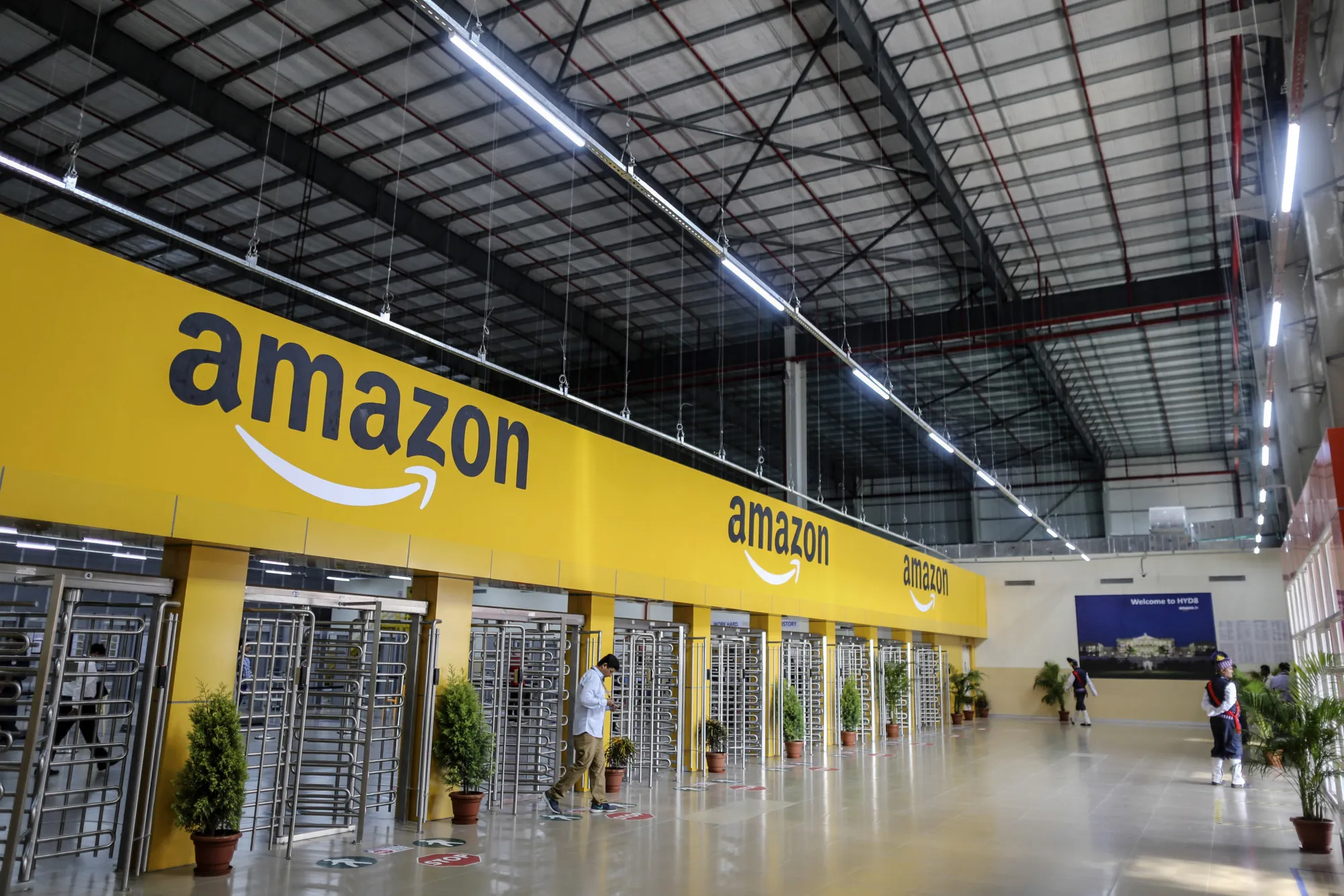 An employee exits the warehouse floor of an Amazon.com fulfillment center in Hyderabad, India.