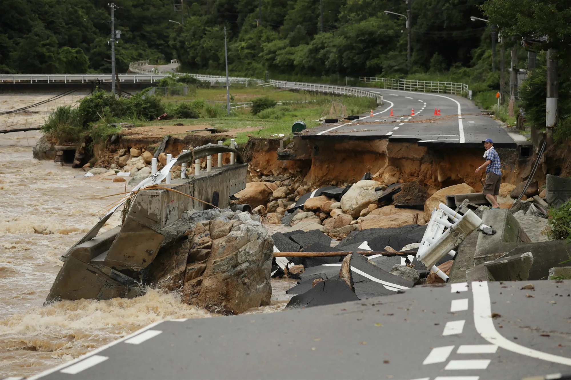 A collapsed road due to heavy rain in Hiroshima on July 7.