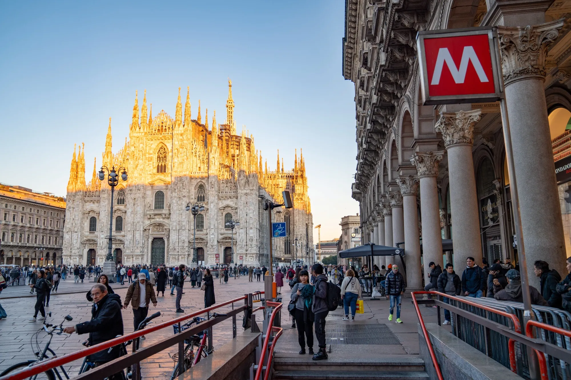 Pedestrians near the Metro station in Duomo square in Milan, Italy.