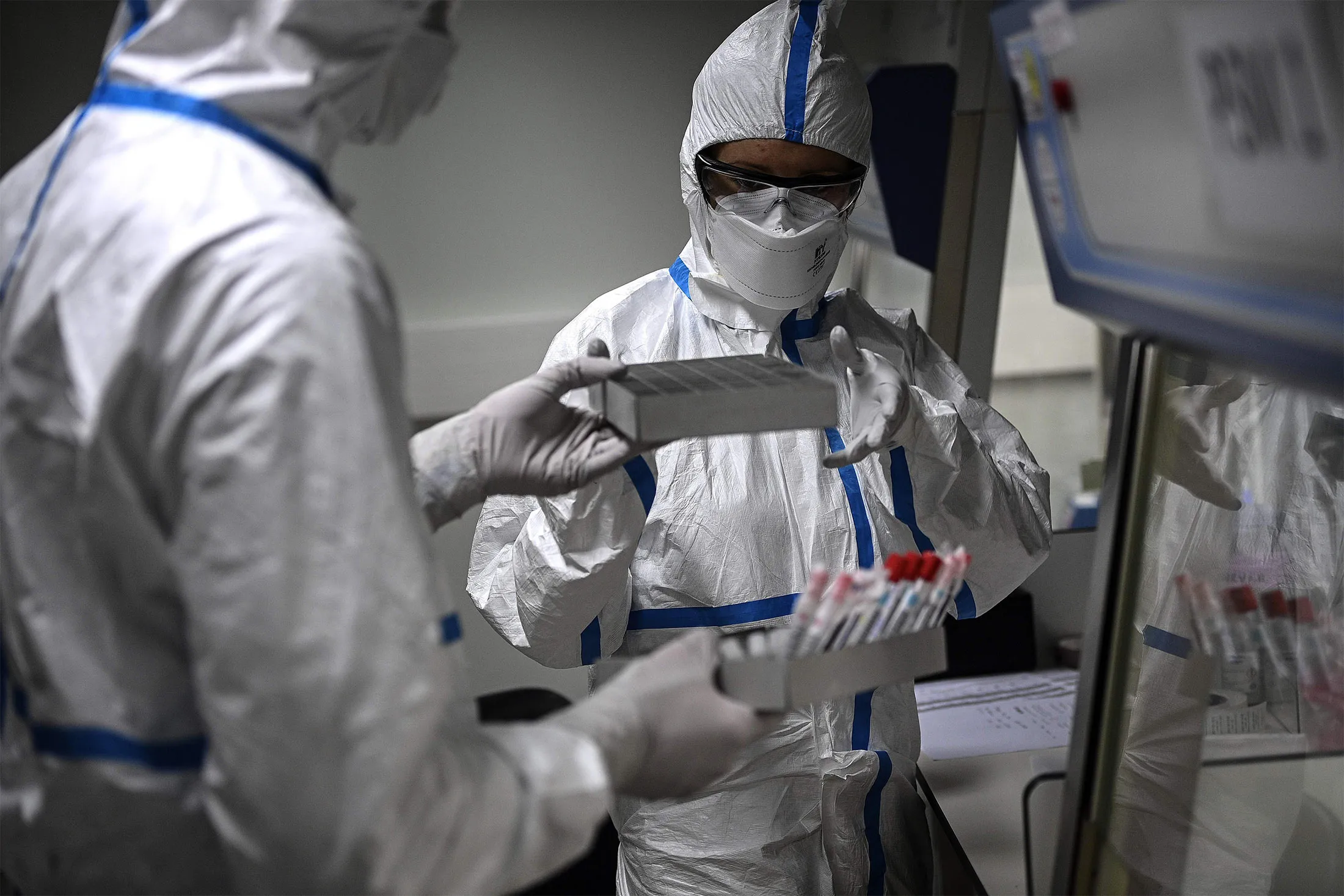 Technicians work on the genome sequencing of Covid-19 variants at the Pasteur Institute in Paris.