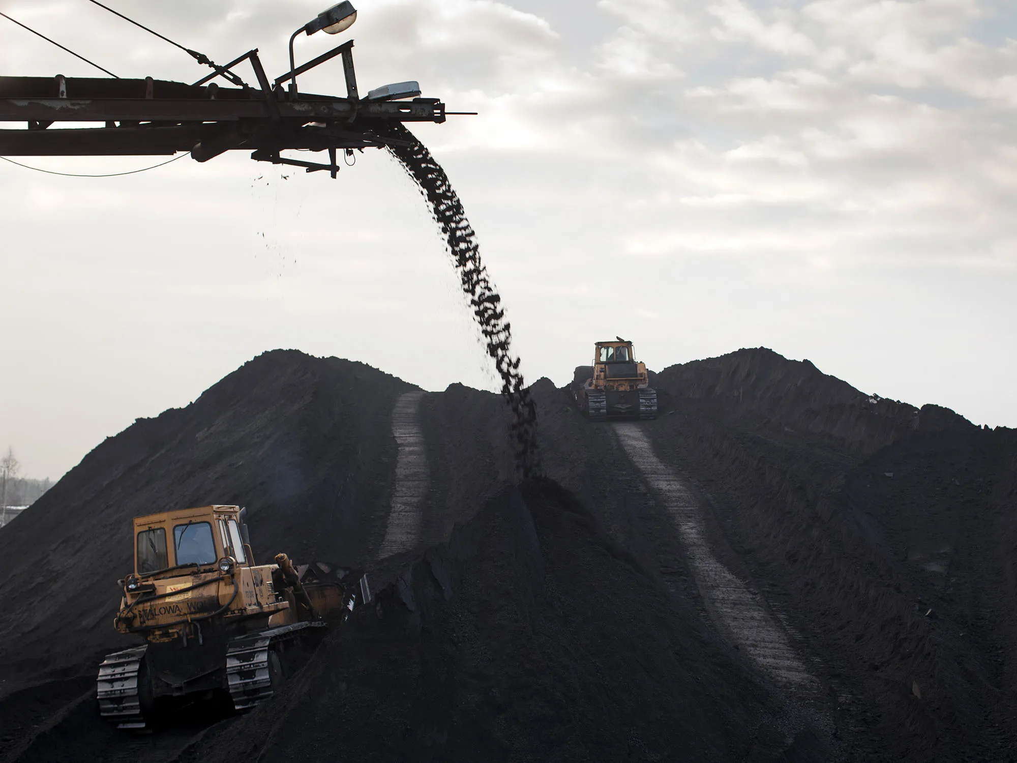 Bulldozers shift coking coal.