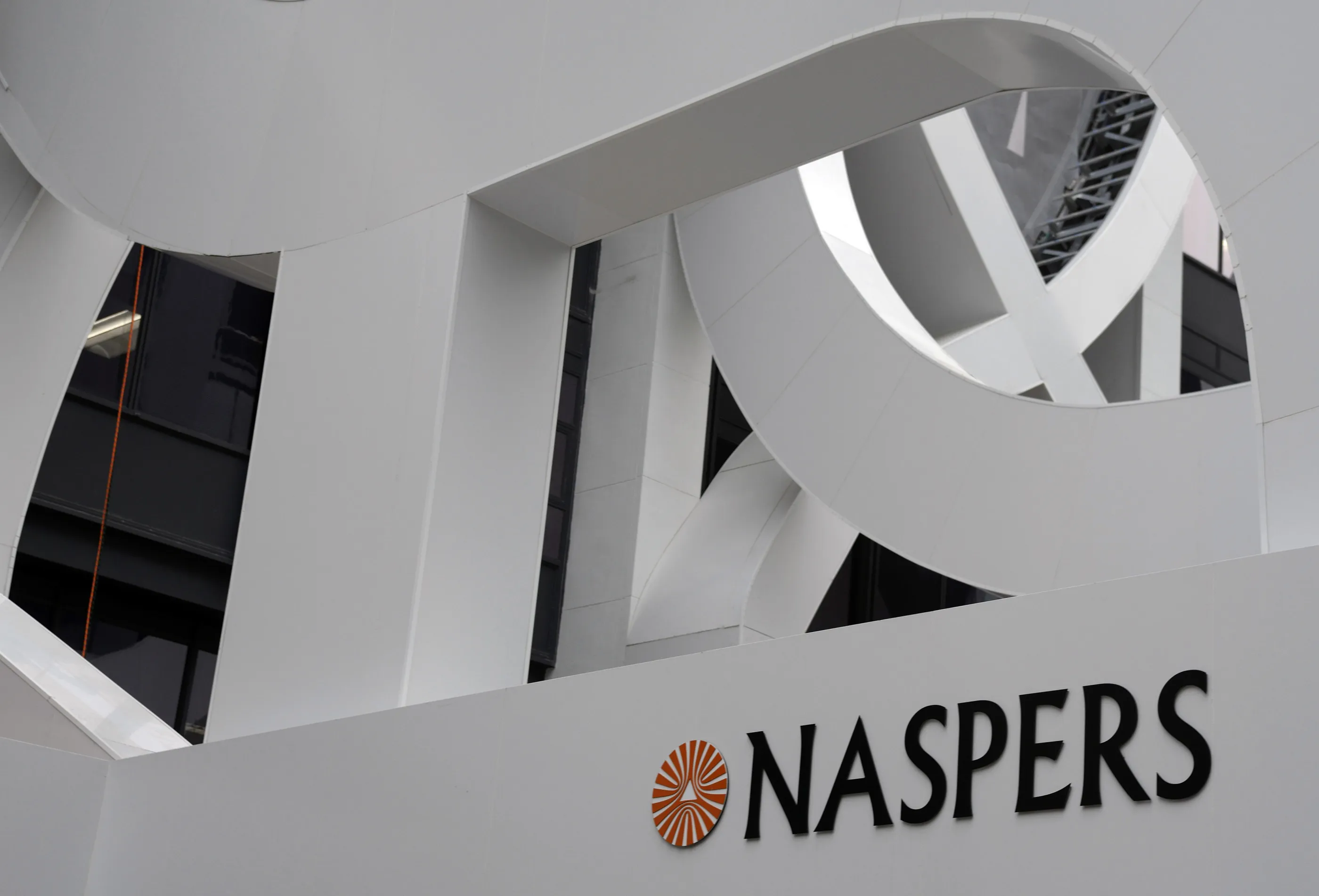 A logo of Naspers Ltd. sits on the side of the headquarters of the Media24 Ltd. building in Cape Town, South Africa.