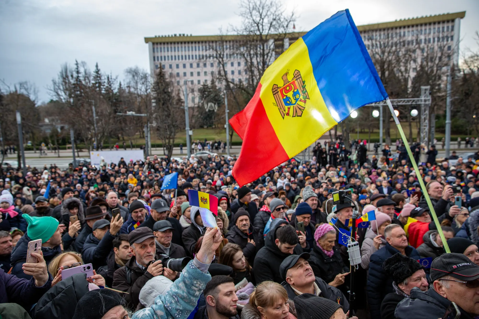Attendees hold Moldovan national flags as they take part in a rally in Chisinau, Moldova,&nbsp;on Dec. 17.
