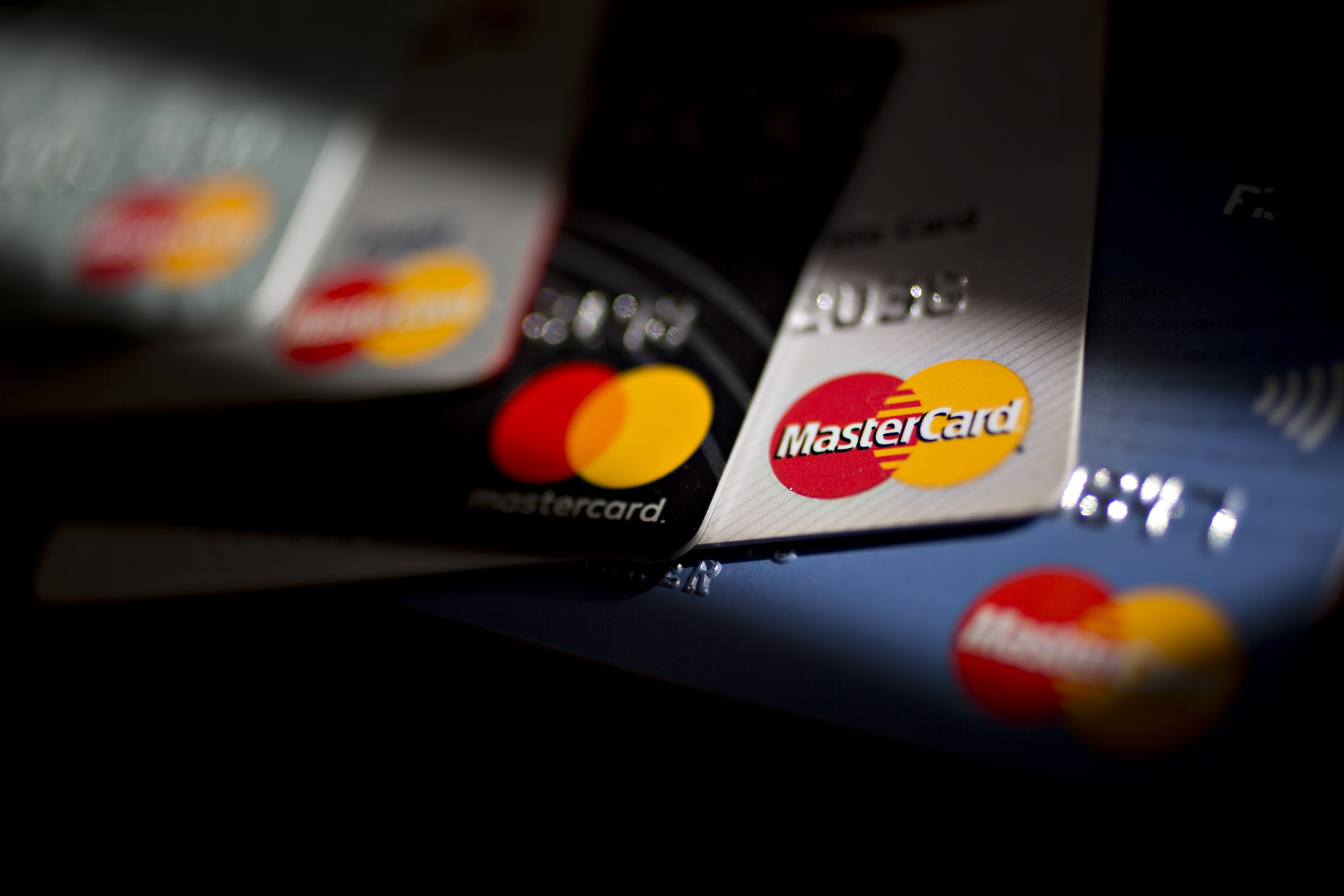 Mastercard Inc. credit and debit cards are arranged for a photograph.
