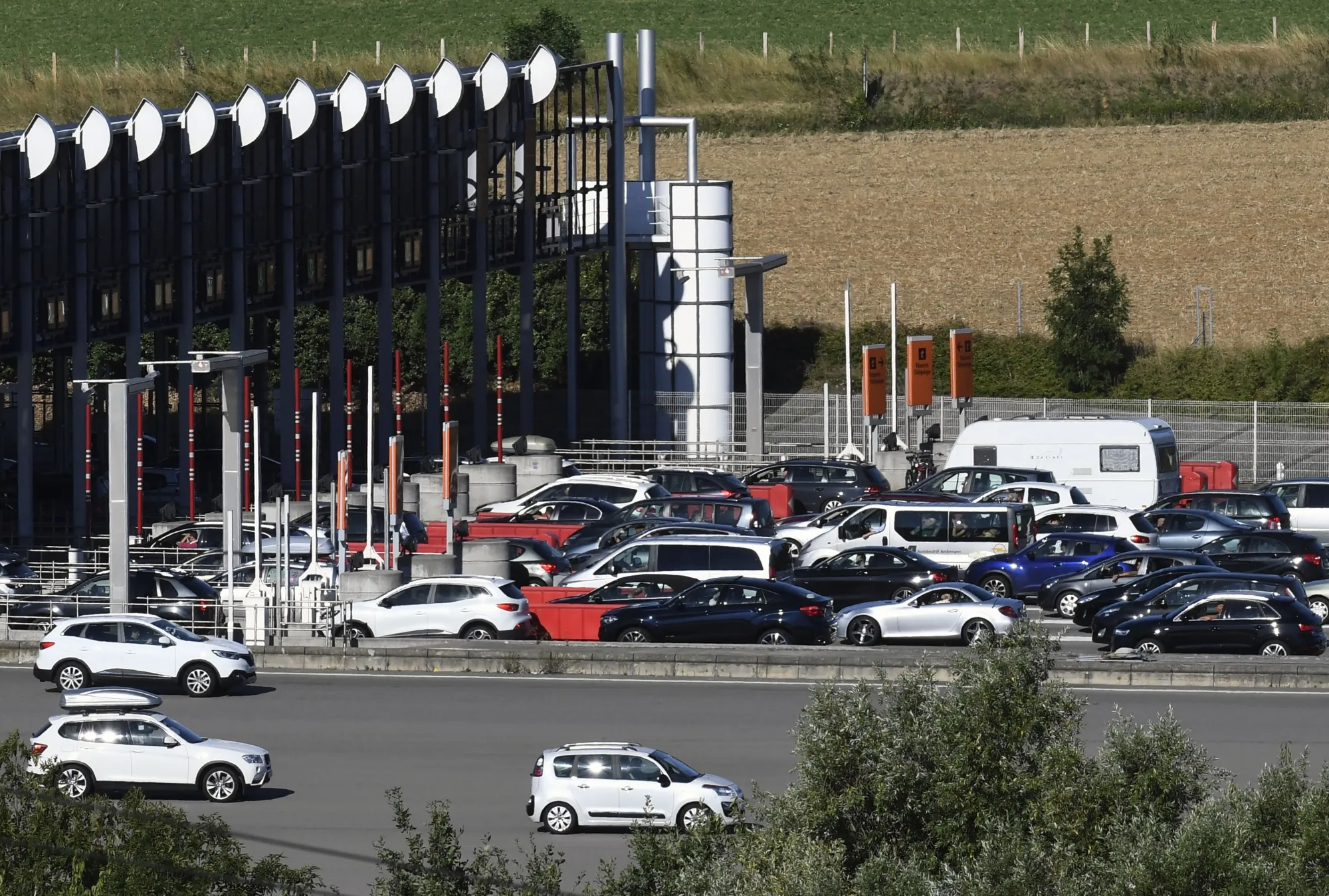 Vehicles at a toll station on the A7 motorway near Vienne, southeastern France.