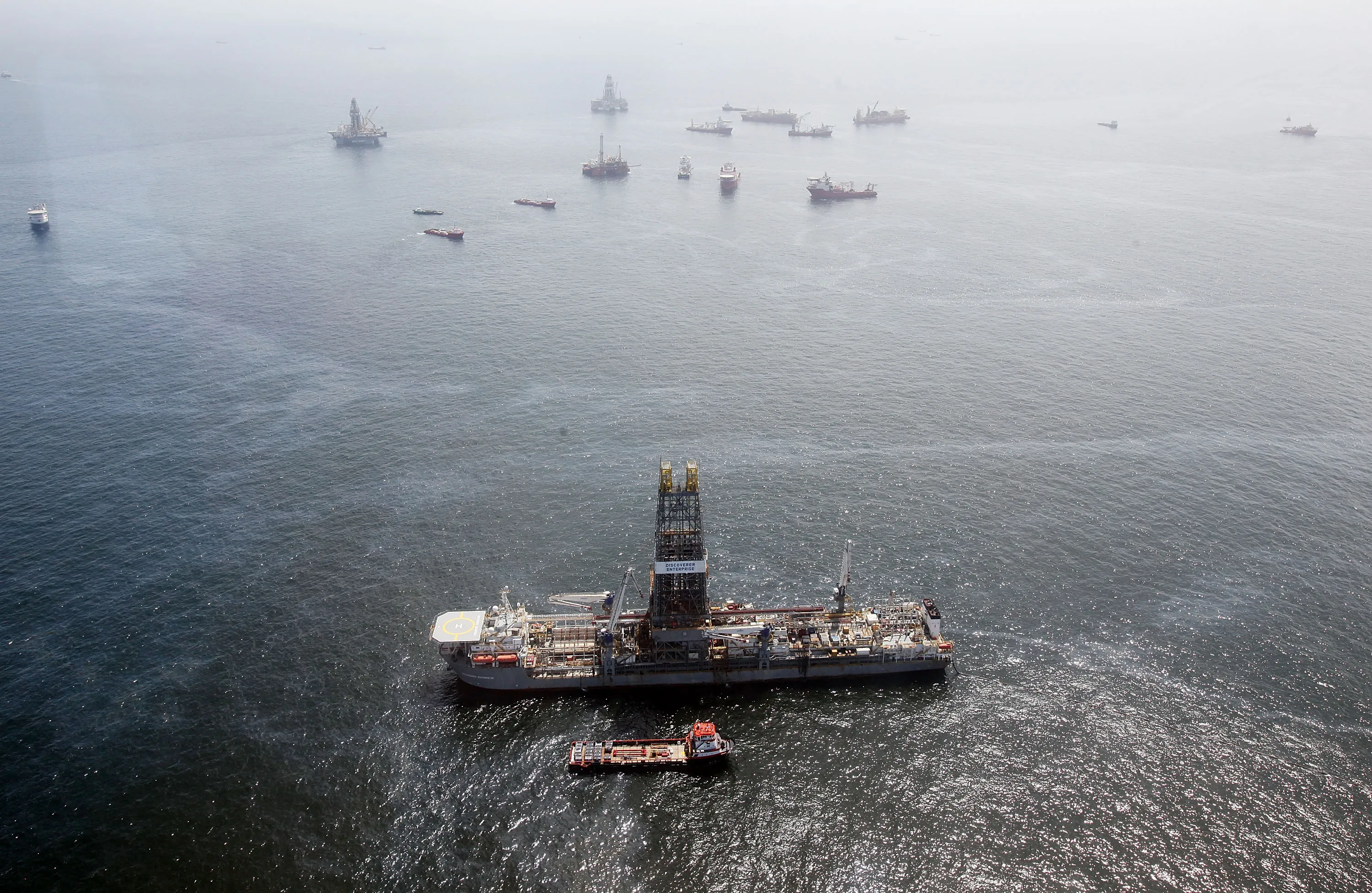 Oil sheen is seen with vessels assisting near the source of the BP Deepwater Horizon oil spill.