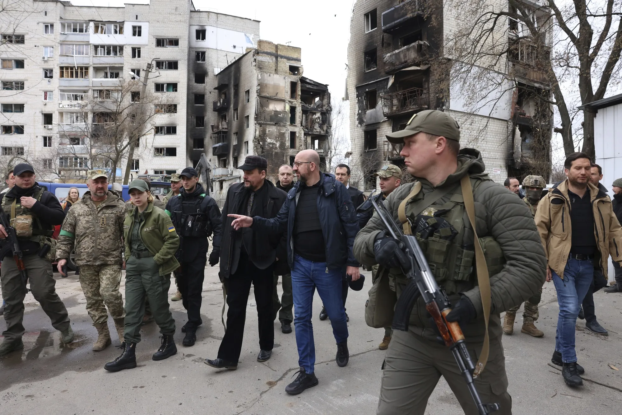 In this image provided by the European Council, European Council President Charles Michel, center, as he is given a tour of the region of Borodyanka, Ukraine, Wednesday, April 20, 2022. (Dario Pignatelli/European Council via AP)