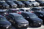 Jeep and Dodge vehicles are displayed for sale at a Fiat Chrysler Automobiles (FCA) car dealership in Moline, Illinois, U.S., on Saturday, July 1, 2017.