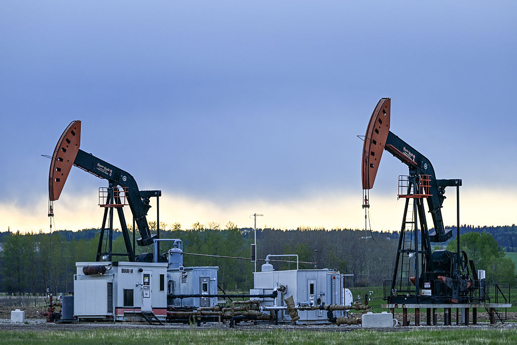 ALBERTA, CANADA MAY 22: Oil wells seen in a field seen along Highway 27 between Sundre and Olds, in Alberta, Canada on May 22, 2025. (Photo by Artur Widak/NurPhoto via Getty Images)