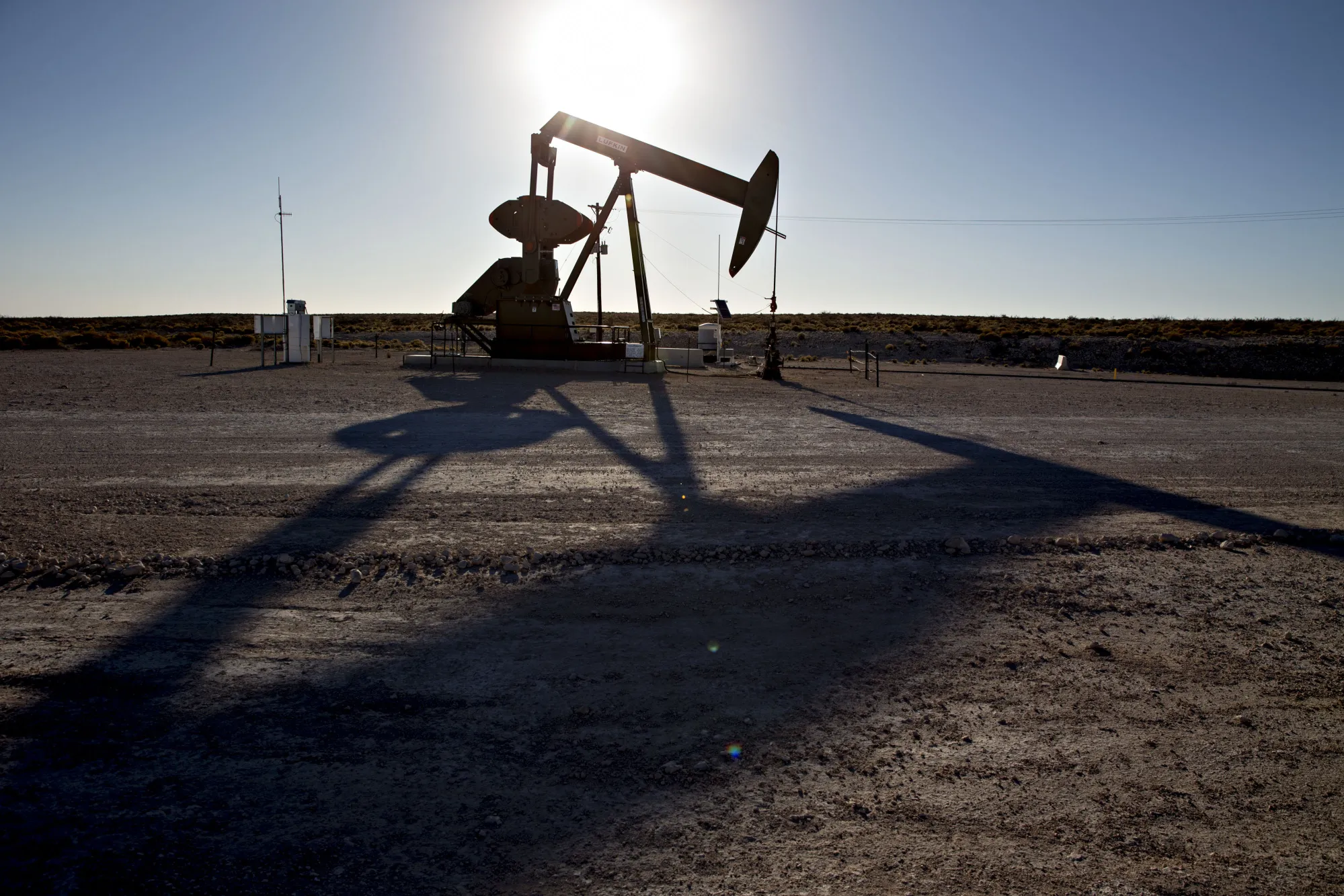 A pumpjack operates on an oil well in the Permian Basin near Orla, Texas.
