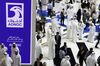 Delegates pass the Abu Dhabi National Oil Co. (ADNOC) display during the Abu Dhabi International Petroleum Exhibition & Conference (ADIPEC) in Abu Dhabi, United Arab Emirates, on Tuesday, Nov. 13, 2018. OPEC’s secretary-general, energy ministers from Saudi Arabia to Russia, CEOs at oil majors from Total SA, BP Plc and Eni SpA, and officials from Middle Eastern energy giants such as Abu Dhabi’s Adnoc have gathered to sign deals and discuss oil, gas, refining and petrochemical issues.