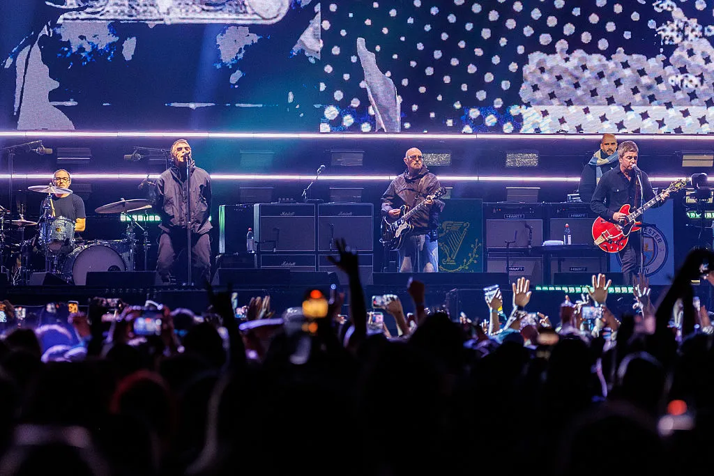 Oasis perform onstage at the Oasis Live '25 World Tour, in California.