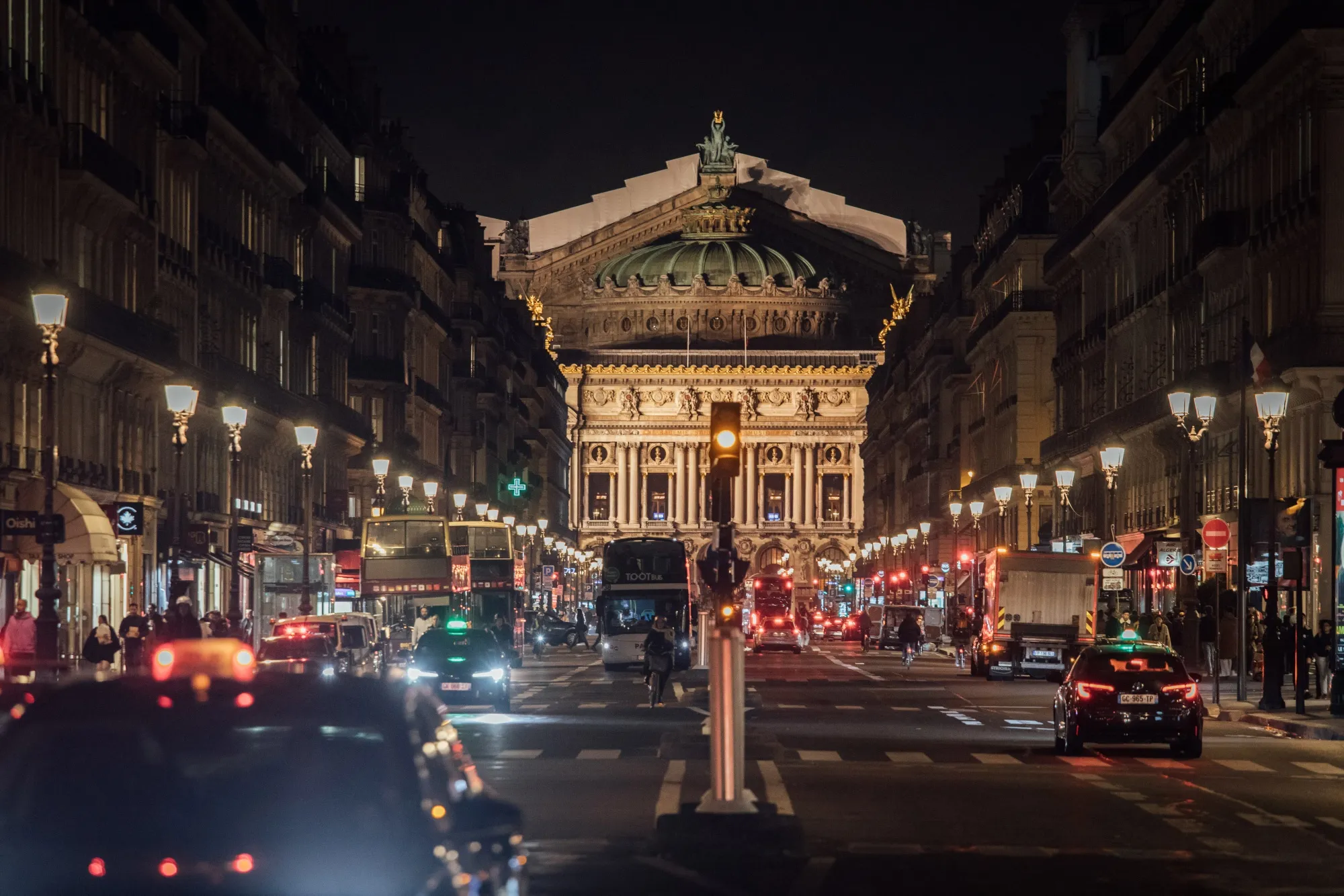 Stores along a road leading to the national opera house in Paris, France.
