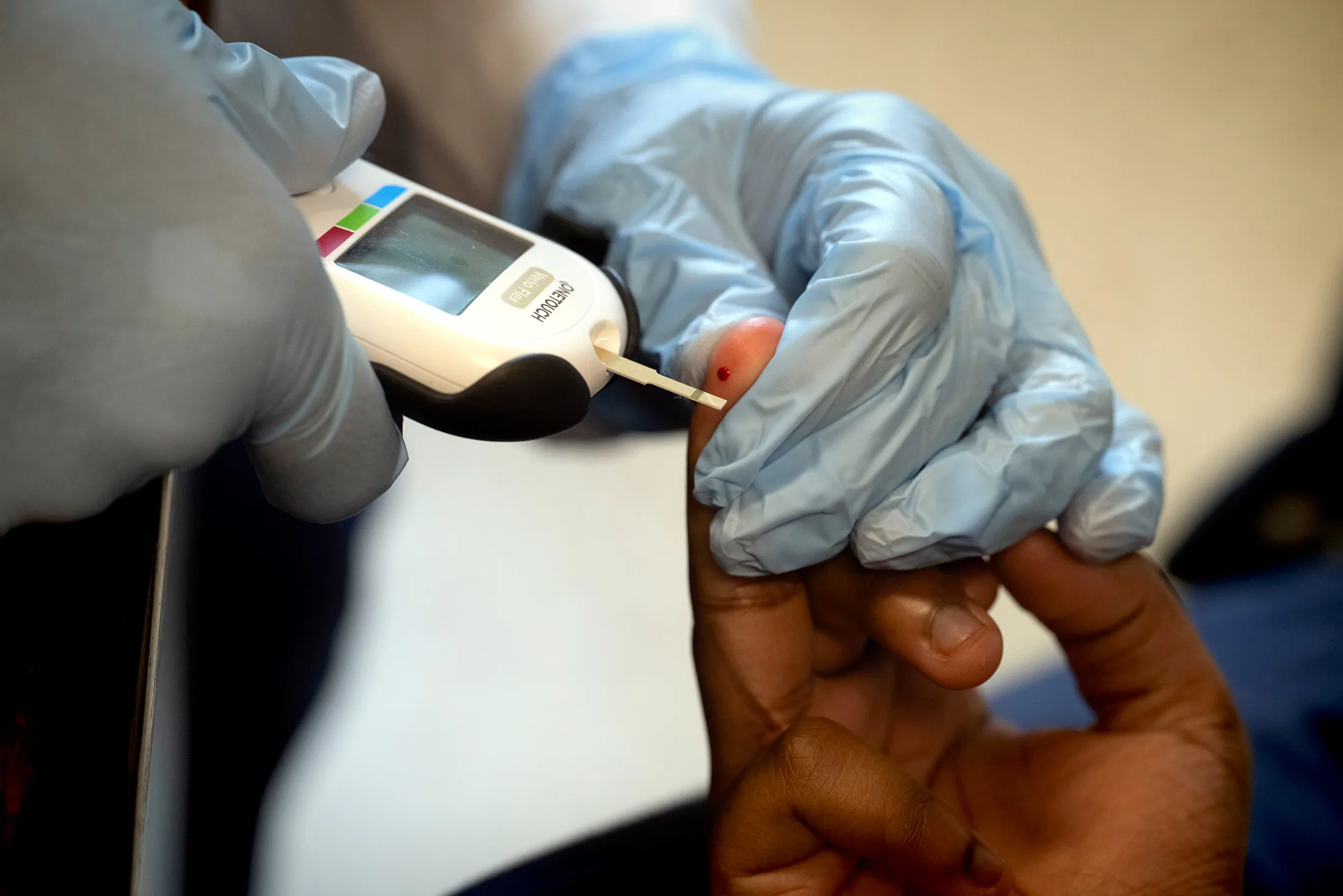 A nurse helps a student with a LifeScan OneTouch glucose at a school&nbsp;in Upper Marlboro, Maryland on June 10.
