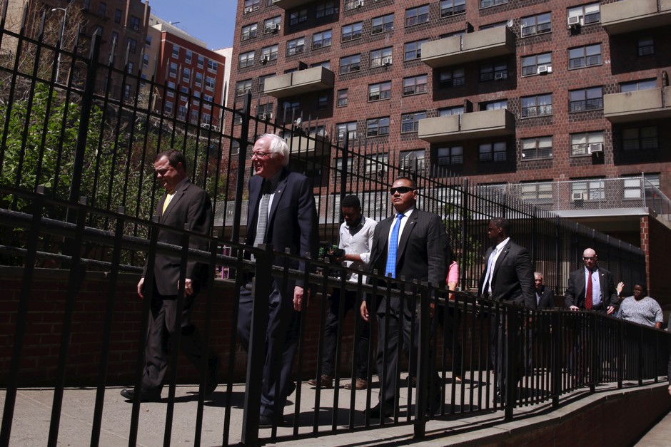 Senator Bernie Sanders tours a NYCHA housing development in the Bronx borough of New York in 2016.