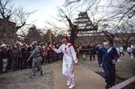 Former Olympian Motoko Obayashi runs with the torch during the Tokyo 2020 Olympic Games torch relay at Tsurugajo Castle in Fukushima Prefecture on March 26.