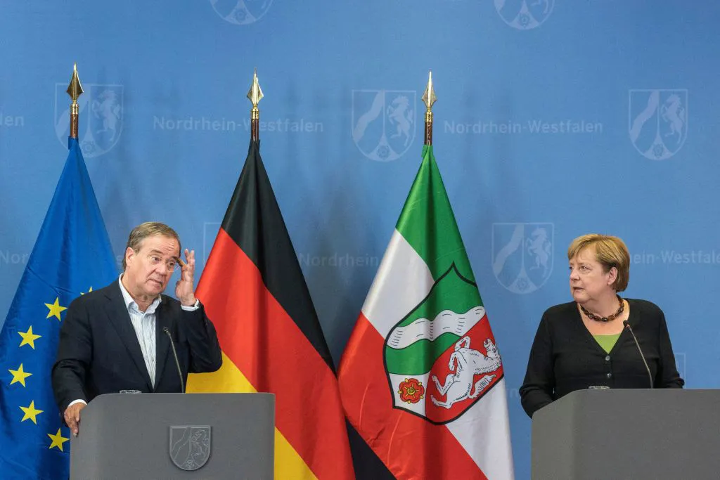 Angela Merkel and Armin Laschet at a news conference after visiting flood-hit regions in Hagen, Germany on Sept. 5.