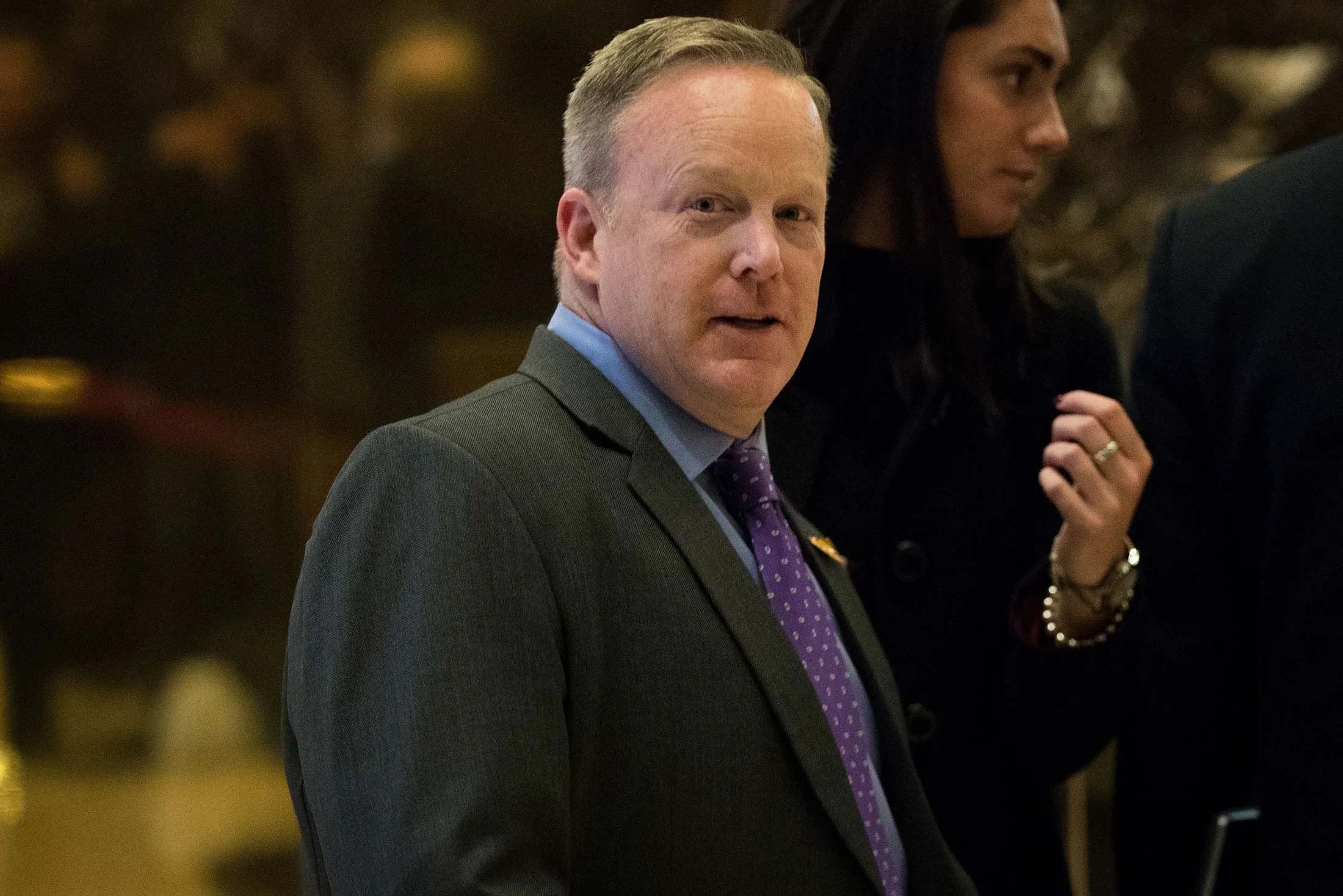 Sean Spicer walks through the lobby at Trump Tower, Dec. 14, 2016 in New York City.
