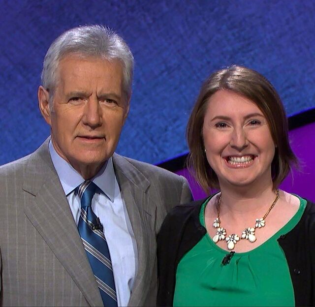Kerry Benn with former <i>Jeopardy!</i> host Alex Trebek on set.