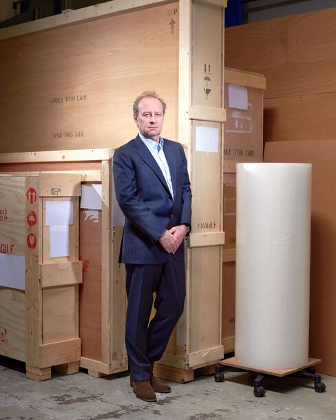 Yves Bouvier stands inside the freeport in Geneva where he started an art shipping business in the late 1980s.