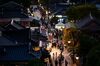 People walk along the Jeonju Hanok Village at night in Jeonju, South Korea, on Friday, Sept. 13, 2019. Relations between Tokyo and Seoul have plumbed new depths over the past few months, as lingering resentment over Japan’s 1910-1945 colonization of the Korean Peninsula resurfaced. Disputes have damaged trade and tourism, as well as military ties between the two U.S. allies.