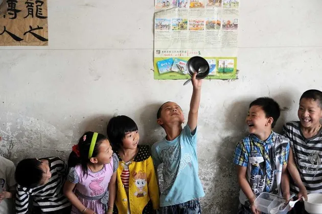 Young Chinese children attend a kindergarten set up for migrant workers in Beijing