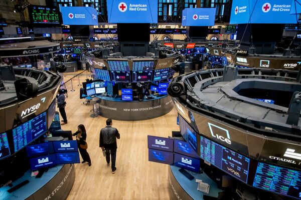 Traders work on the floor of NYSE