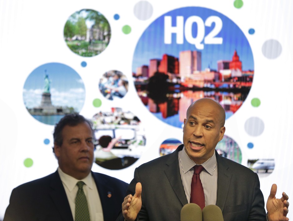 Senator Cory Booker (right) and then-New Jersey Governor Chris Christie during an announcement in Newark in October. Before leaving office, Christie signed off on $7 billion in tax breaks to Amazon in an effort to lure the company's second headquarters.