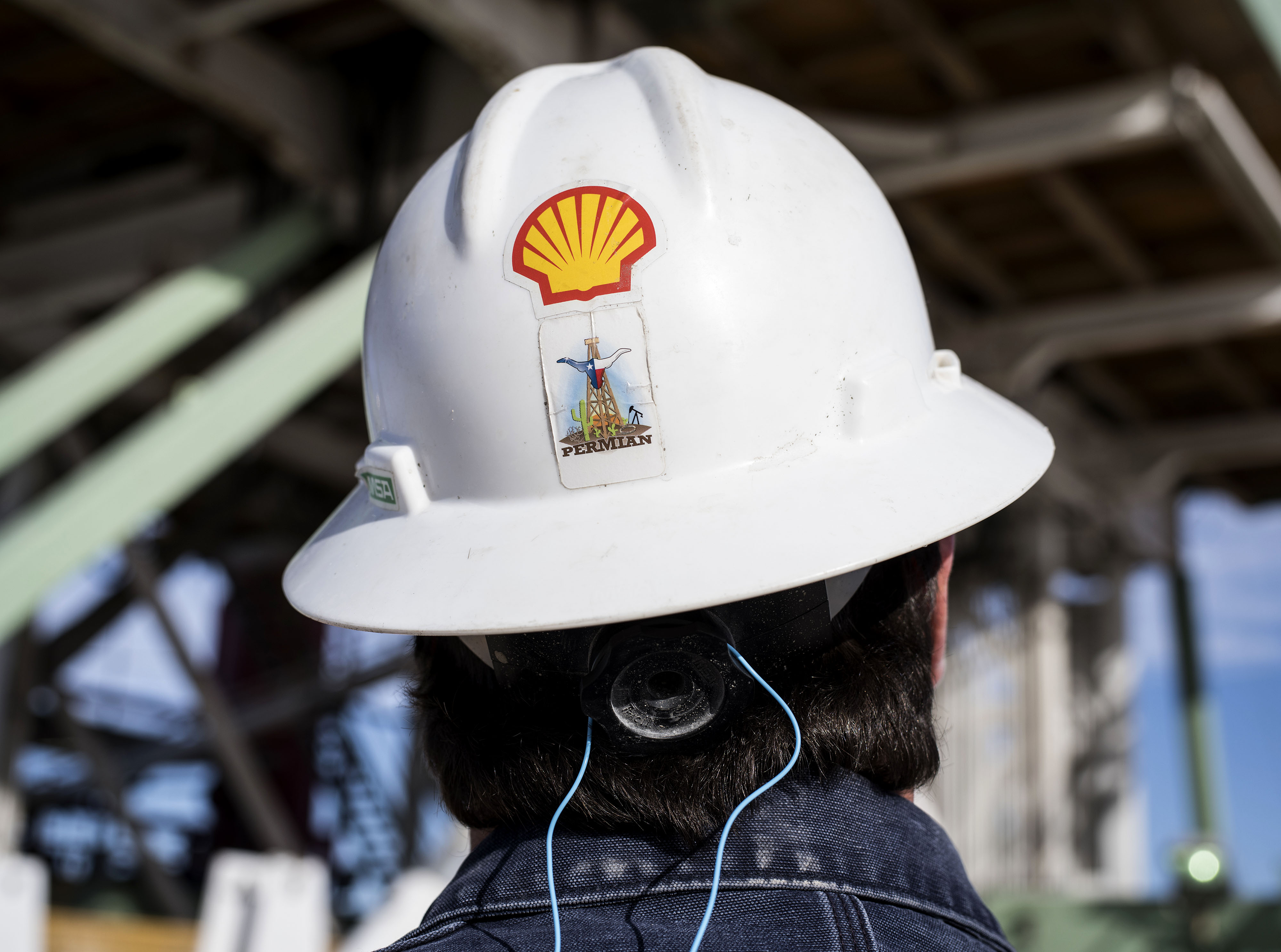 Royal Dutch Shell Plc hard hat with a Permian Basin sticker on an oil rig near Mentone, Texas. Photographer: Matthew Busch/Bloomberg