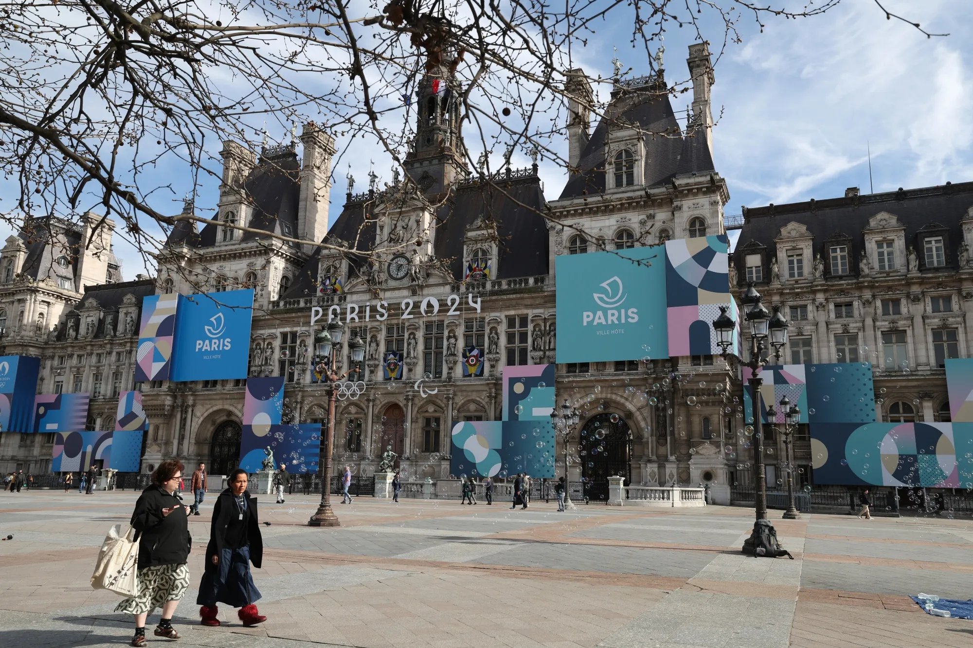 The Paris 2024 logo on the facade of the town hall in Paris, France.