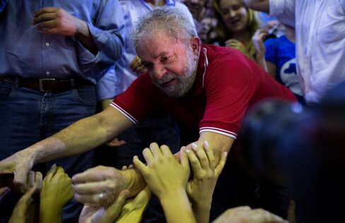 Former President of Brazil, Luiz Inacio Lula da Silva, greets supporters at a rally in Sao Paulo, on March 4.