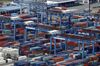 Wan Hai Lines Ltd. shipping containers sit stacked with other containers at the Oi Container Terminal in this aerial photograph taken in Tokyo, Japan, on Wednesday, June 24, 2015.