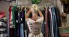 A shopper browses clothing at a second hand store in Kensington Market in Toronto, Ontario, Canada.