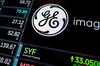 A monitor displays signage for General Electric Co. (GE) on the floor of the New York Stock Exchange (NYSE) in New York, U.S., on Monday, Oct. 23, 2017. U.S. stocks got off to a slow startas investors prepared for a big week of earnings reports, awaited possible changes at the Federal Reserve and monitored the progress of tax reform.