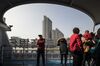 Tourists ride on a ferry crossing the Huangpu River as the Bund Soho building complex stands in the Lujiazui Financial District in Shanghai, China, on Monday, Feb. 26, 2018. Xi Jinping's decision to cast aside China's presidential term limits is stoking concern he also intends to shun international rules on trade and finance, even as he champions them on the world stage.