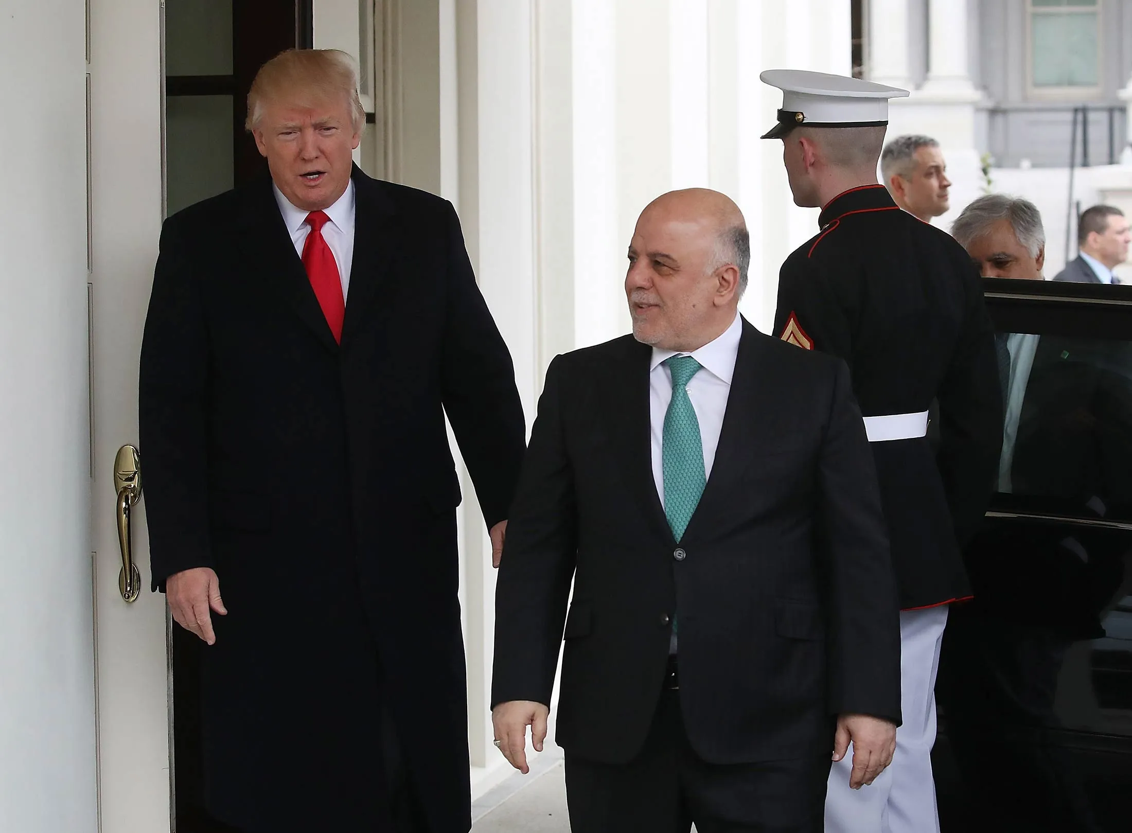 U.S. President Donald Trump, left, welcomes Iraqi Prime Minister Haider al-Abadi upon his arrival for a meeting at the White House, on March 20, 2017 in Washington, DC.
