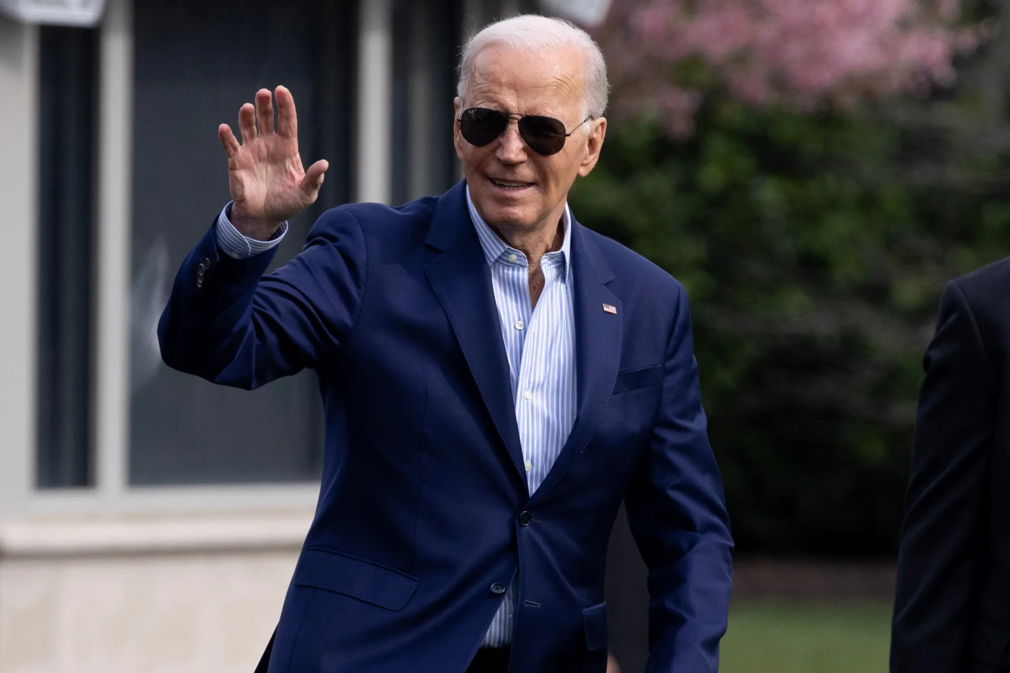 Joe Biden walks on the South Lawn of the White House before boarding Marine One on Friday.
