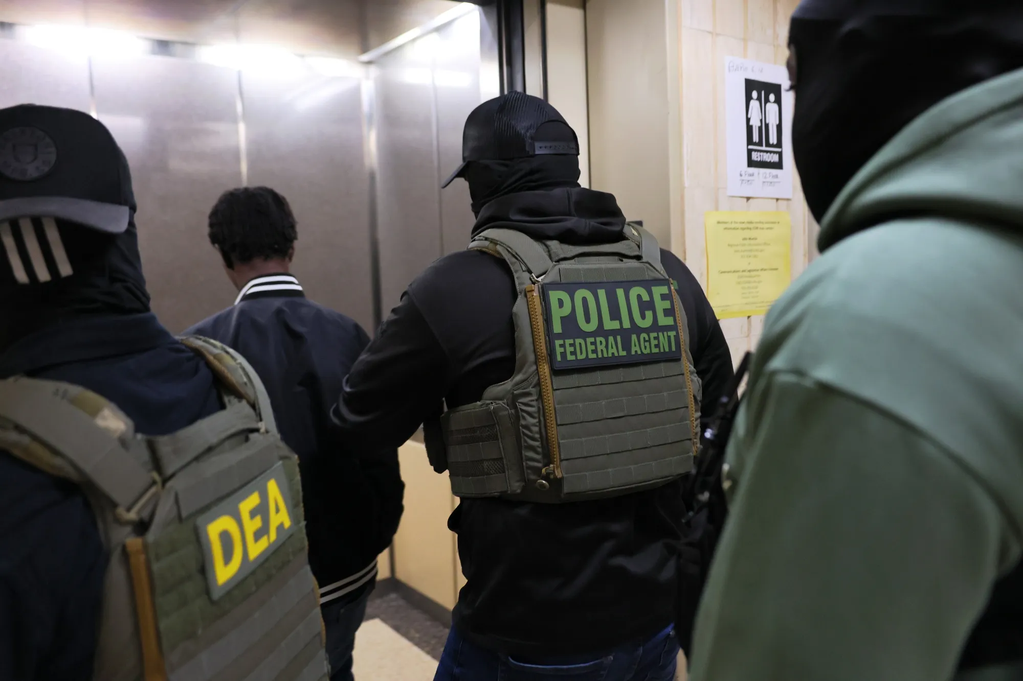 Federal agents detain an individual following a&nbsp;hearing in immigration court at the Jacob K. Javitz Federal Building in New York, on June 10.&nbsp;