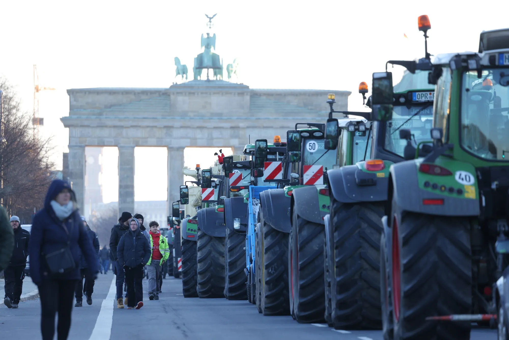 Farmers park tractors at the Brandenburg Gate to protest planned cuts to state subsidies in Berlin, on Jan. 8.