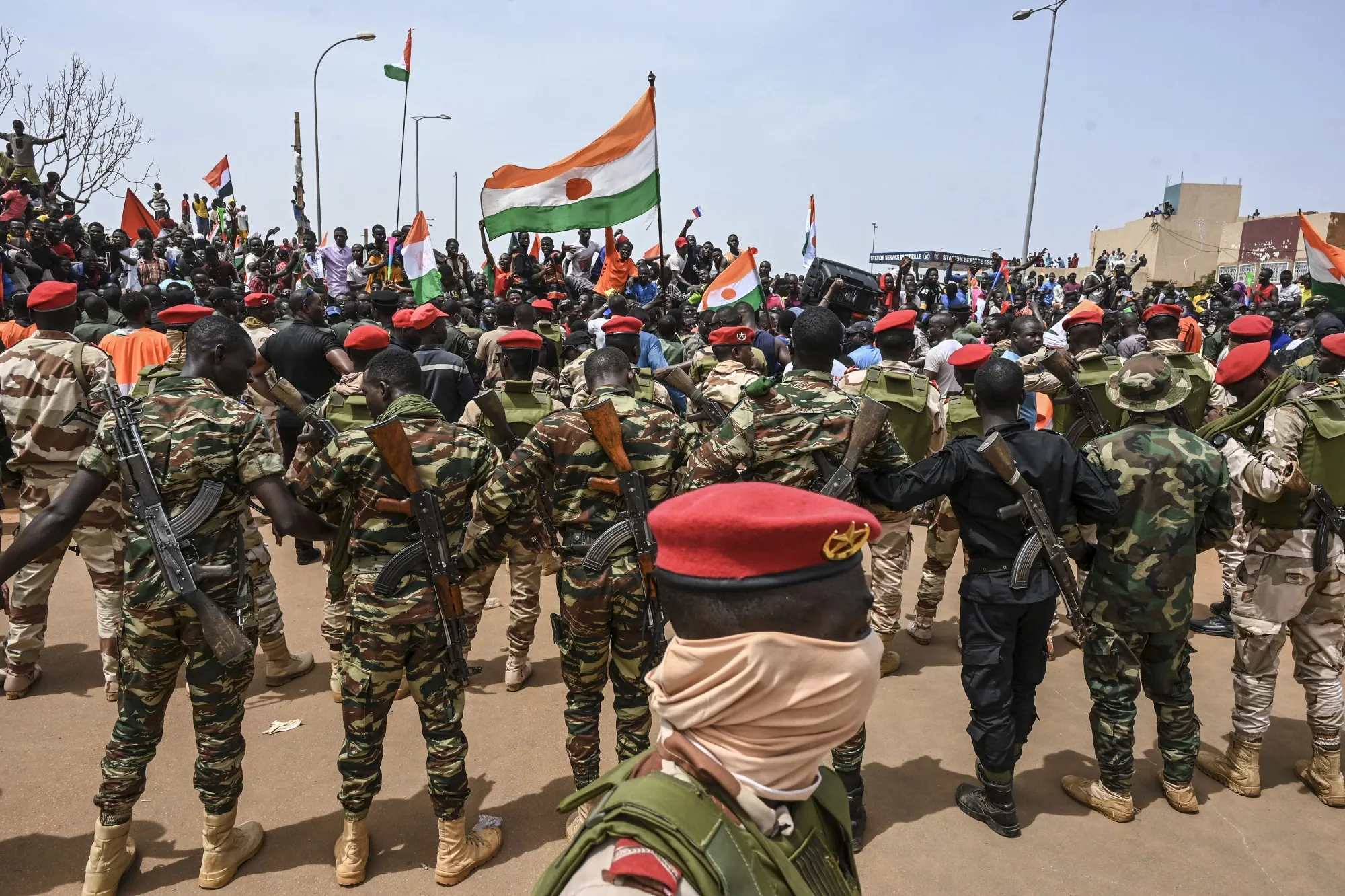 Nigerien soldiers guard as supporters of Niger's National Council of Safeguard of the Homeland protest&nbsp;in Niamey, on Sept.&nbsp;2.&nbsp;