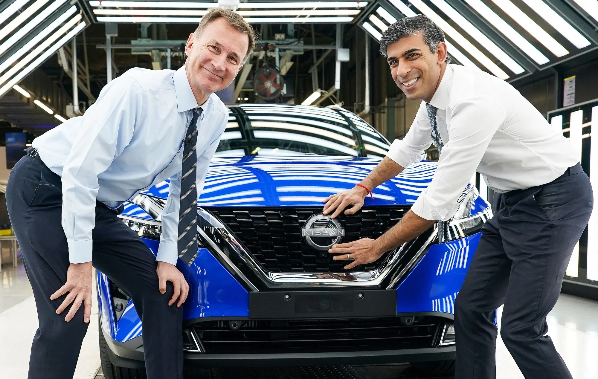 Britain's Prime Minister Rishi Sunak and Britain's Chancellor of the Exchequer Jeremy Hunt are smiling.&nbsp;