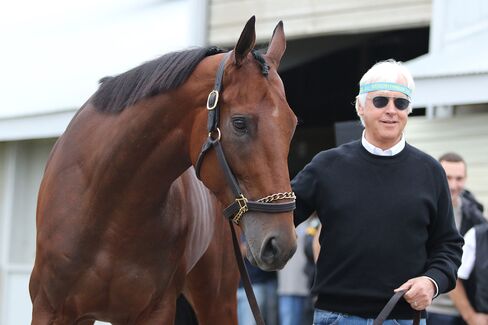 American Pharoah and trainer Bob Baffert outside his barn the morning after winning the Breeders' Cup Classic at Keeneland Race Track, on Nov. 1, in Lexington, Kentucky.