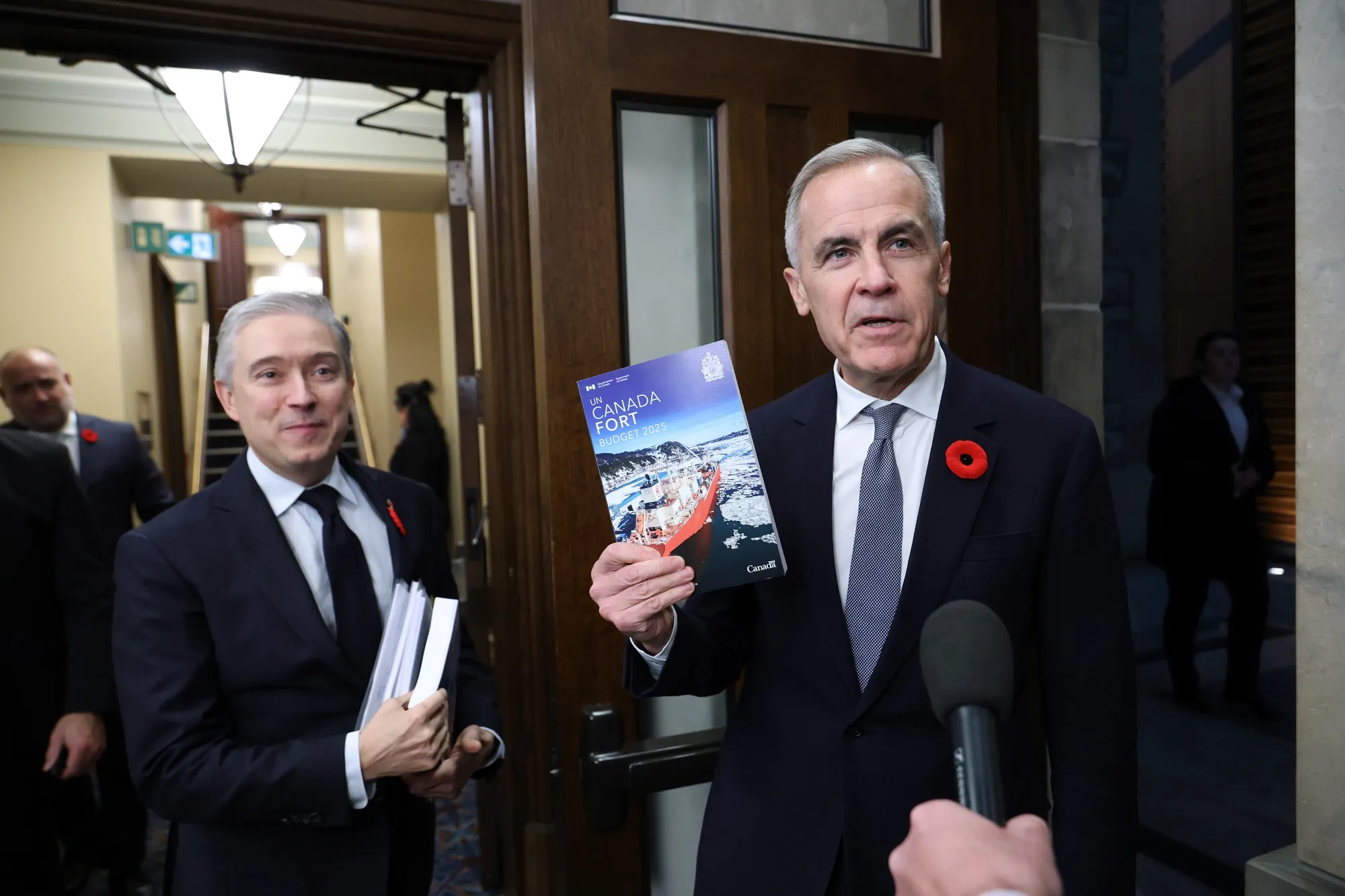 Mark Carney, right, and Francois-Philippe Champagne before releasing the federal budget in Ottawa on Nov. 4.