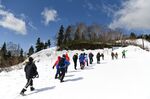 Prospective students of Harrow International School Appi Japan hike up a mountain near the school's campus in Hachimantai, Iwate Prefecture.