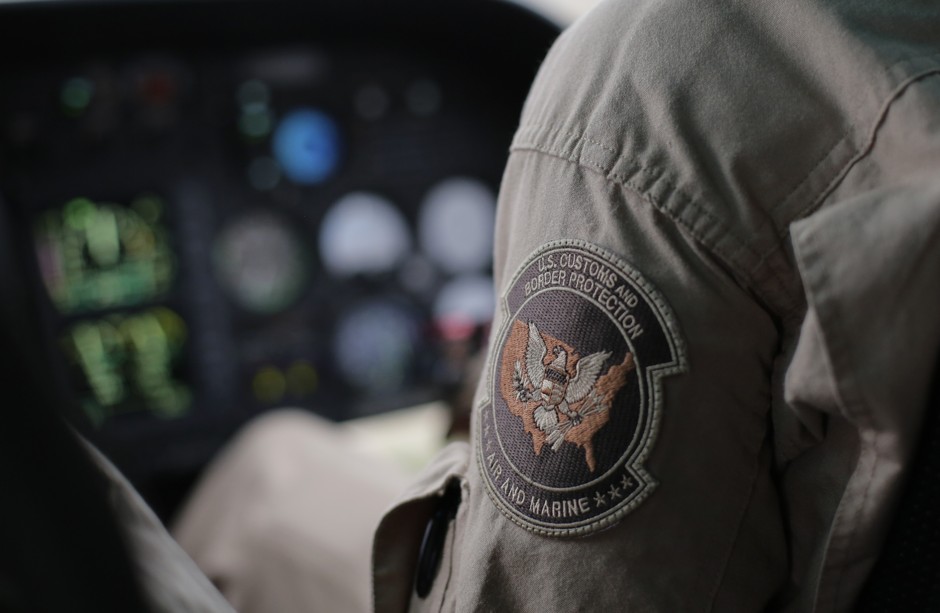 A U.S. Customs and Border Protection Air and Marine agent patrols near the Texas-Mexico border in Rio Grande City, Texas. 