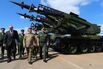 Russian Defense Minister Sergei Shoigu&nbsp;(center) inspects a Cuban tank division during a 2015 visit to Havana.
